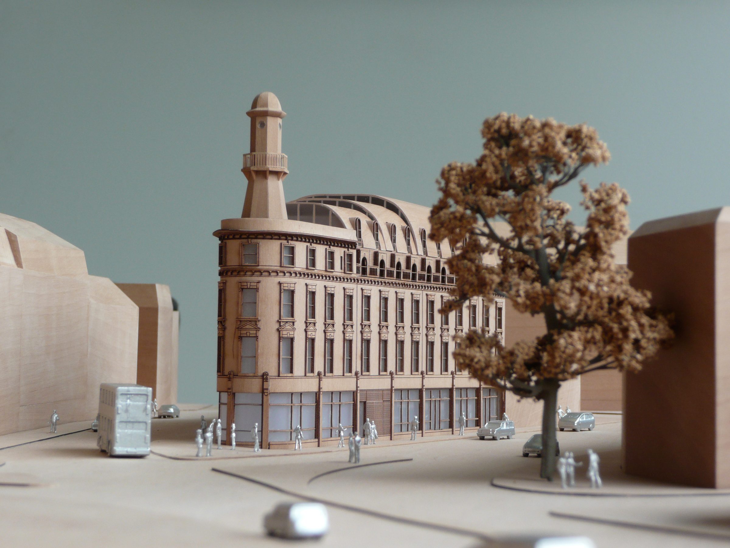 Physical model of the building on its corner site, showing the turret and the surrounding streets