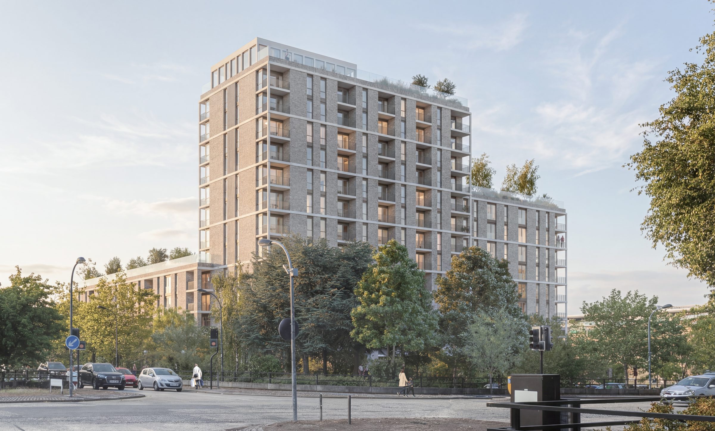 Visualisation of the scheme from the street junction, brick elevations with recessed balconies rising to the taller block