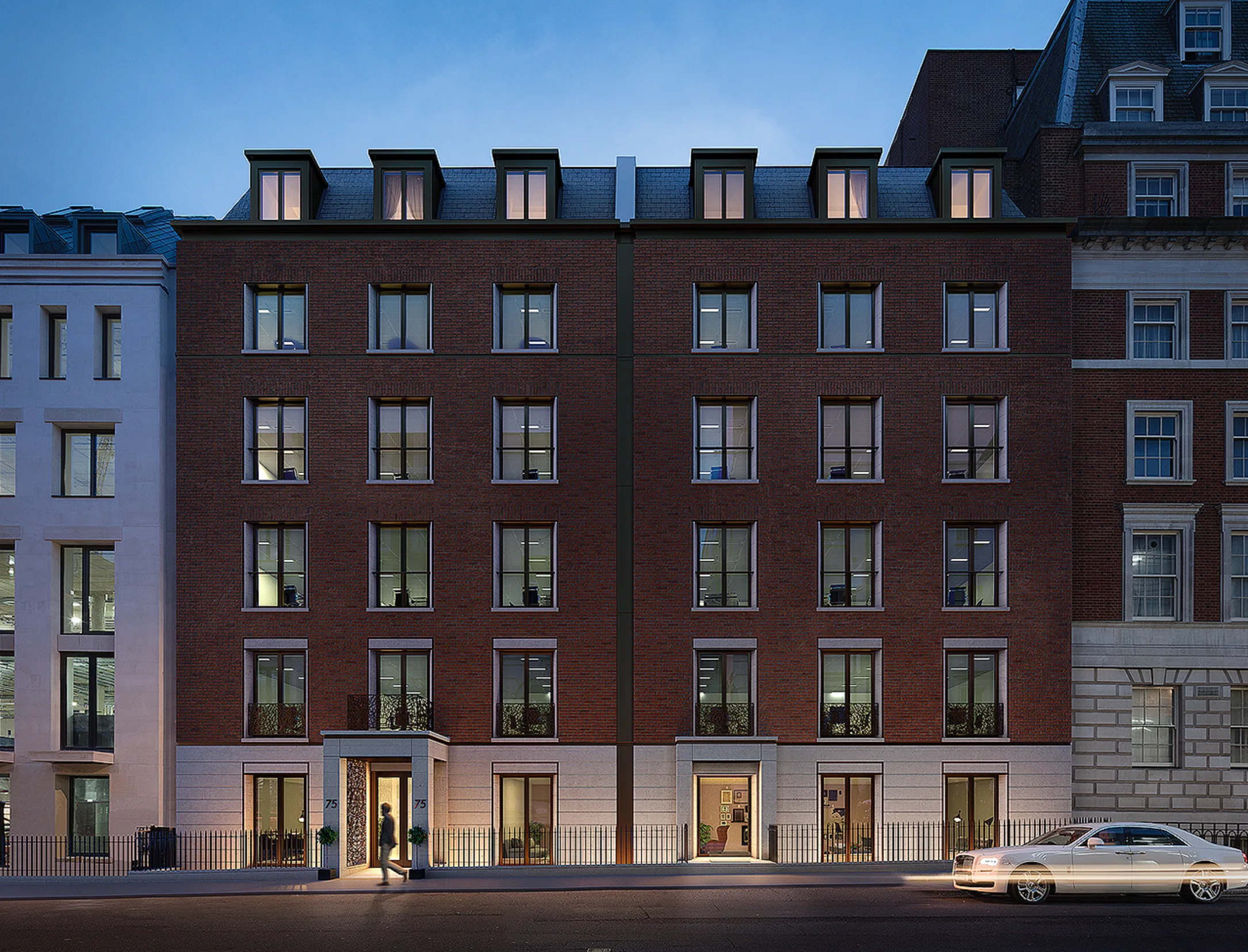 Visualisation of the brick elevation at dusk, with lit windows and dormers in the slate mansard above